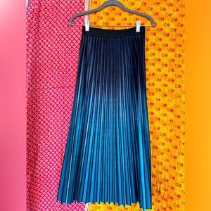 Pleated, soft, velvety skirt.